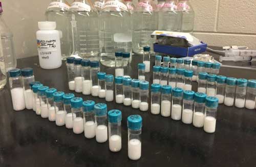 Vials containing microgel particles await analysis