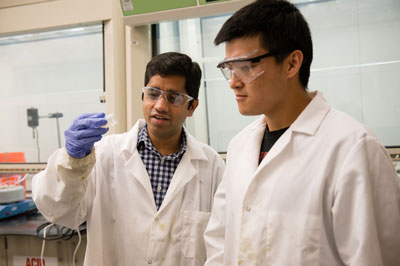 Srikanth Pilla, left, works with a graduate student in their lab