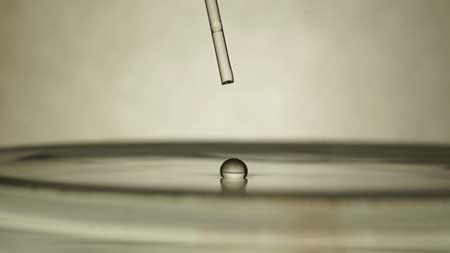 A 2-mm Diameter Acetone Droplet in the Leidenfrost State on a 70 C Water Bath