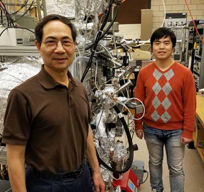 Physics Professor Tai-Chang Chiang and graduate student Caizhi Xu pose in Chang's laboratory