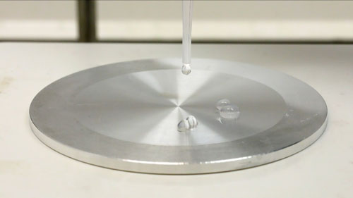 Leidenfrost effect makes water droplets on a hot plate hover over the surface