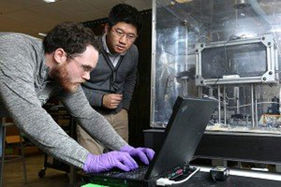Dr. Heng Pan, right, works in his lab with graduate student Brandon Ludwig
