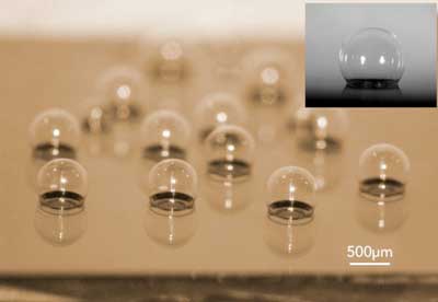 Chip-scale glass microspherical shell sensor array blown on a silicon substrate. Insert is a near-perfect spherical shell