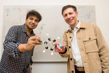 UChicago grad student Manas Sajjan, left, and prof. David Mazziotti, hold a model depicting a molecule