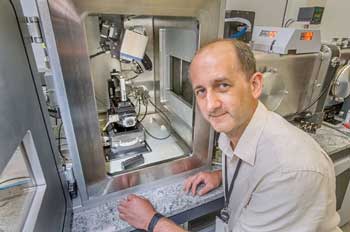 materials scientist Dmytro Nykypanchuk sets up a measurement on a small-angle x-ray scattering instrument