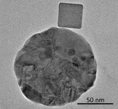 transmission electron microscope image shows a palladium nanocube with a gold disk