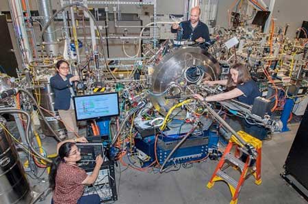 scientists setting up beamline experiment