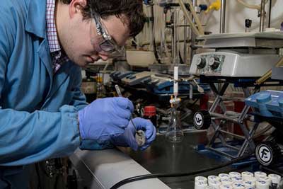 Graduate student Tyler Fulton prepares samples of small molecules in a lab at Caltech