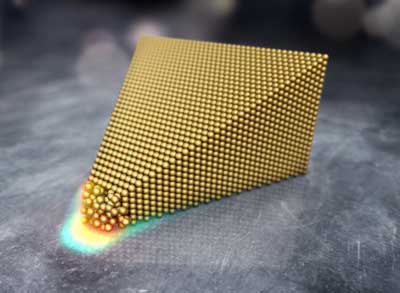 The illustration shows the atoms of a gold cone exposed to a strong electric field
