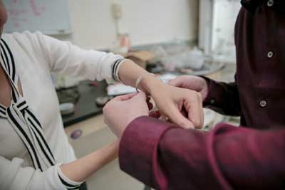 a new wound dressing bandage is fitted around a wrist