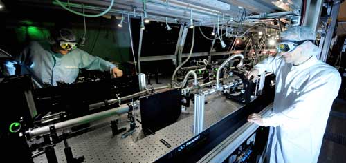 scientists working in a laser physics lab
