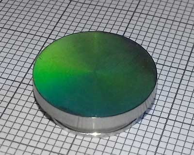 LIPSS on a titanium surface reflecting the flashlight