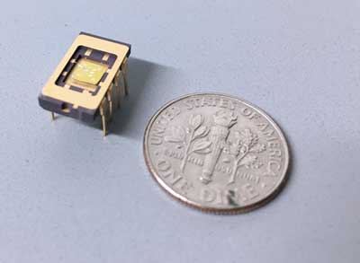 A phononic device next to a dime for scale