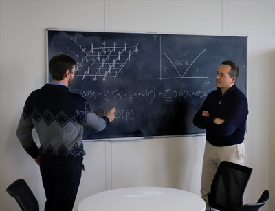 Riccardo Rota and Vincenzo Savona working on the design of their quantum simulator