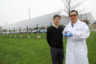 Dr. Zhaoning Song, research assistant professor in the UToledo Department of Physics and Astronomy, holds a a perovskite solar cell mini-module he developed with Dr. Yanfa Yan
