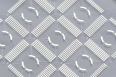 nine nanovolcano-array microchips on a glass wafer