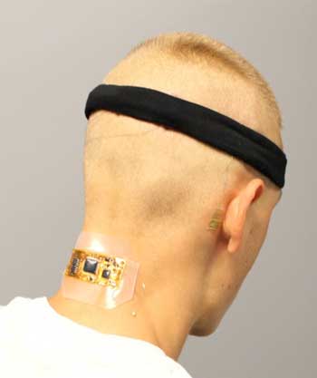 Test subject who has flexible wireless electronics conformed to the back of the neck