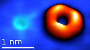 Scanning tunneling microscopy image of an oxygen substituting sulfur (left) and sulfur vacancy (right) in tungsten disulfide