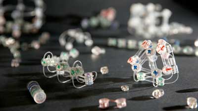 Acrylic panels containing tiny magnets glued onto flexible mylar strips