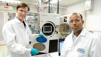 Argonne chemists Jeff Elam (left) and Anil Mane (right) show wafers