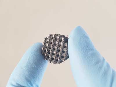 Fingers Holding 3D-Printed Ultra-Robust Graphene-Rubber Sensor