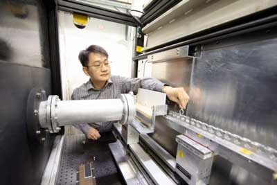 instrument scientist Shuo Qian prepares the Bio-SANS instrument at HFIR for an experiment