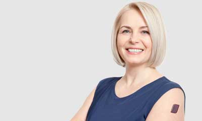 A proof-of-concept personalized nutrition smart patch worn on upper arm of blond woman