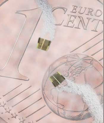 self-propelled electronic micro-robots maneuver in liquid on top of a 1 cent euro coin