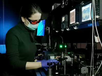 a scientists measures the photo-response of organic solar cells in the lab