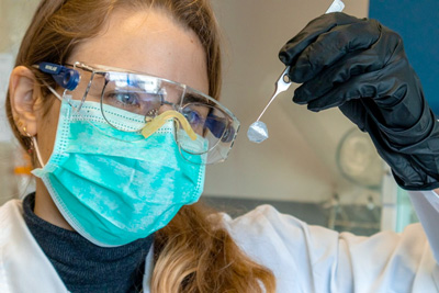 Irene Anton holding a bacterial nanocellulose membrane