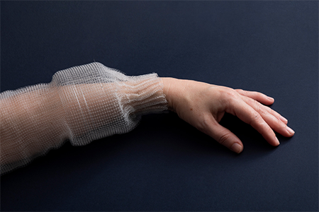 programmable fiber fabric on a forearm