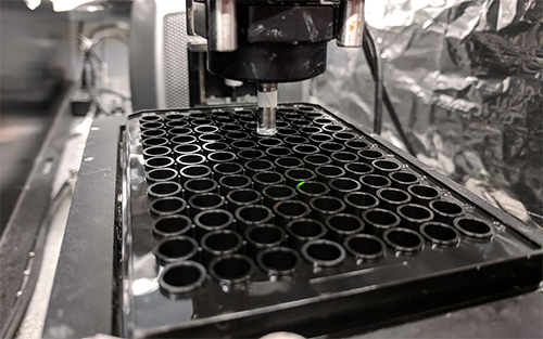 The high-throughput 3D bioprinting setup performing prints on a standard 96-well plate