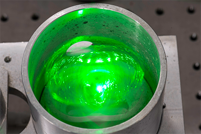 glowing green item inside a container