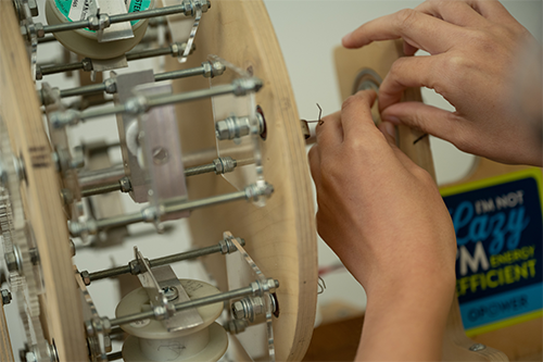 custom device that weaves carbon nanotube fibers into larger threads