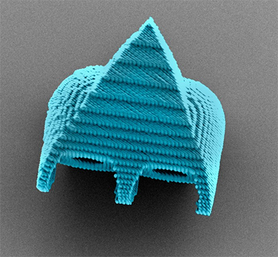 A scanning electron microscope image shows a cell-size robotic swimmer