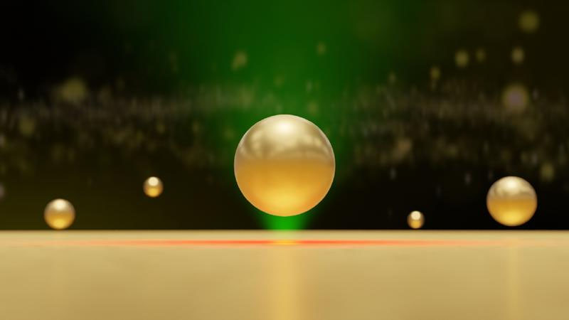 Illustration of a gold nanoparticle trapped near a locally heated gold surface by hydrodynamic and van der Waals forces