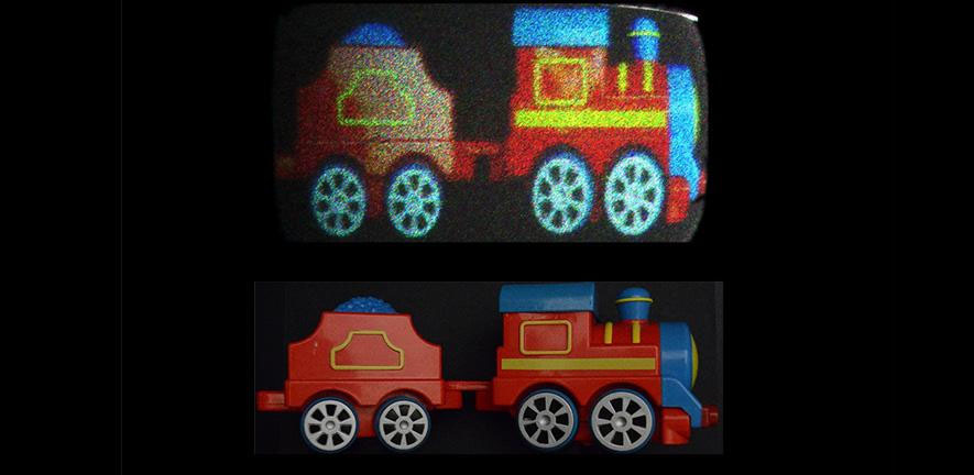 Reconstructed holographic images of a toy train (top) with holobricks and original image captured by a camera (bottom)