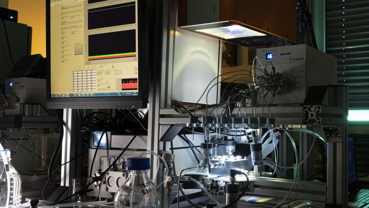 Photocatalytic membrane filtration system with a sun simulator