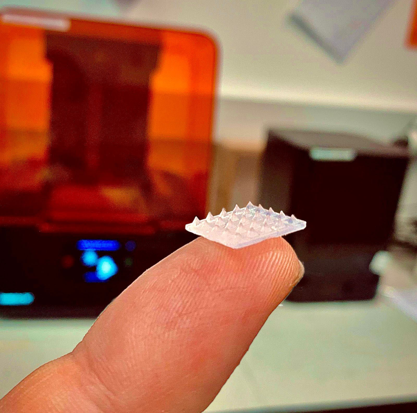 microneedle patch on the tip of a finger