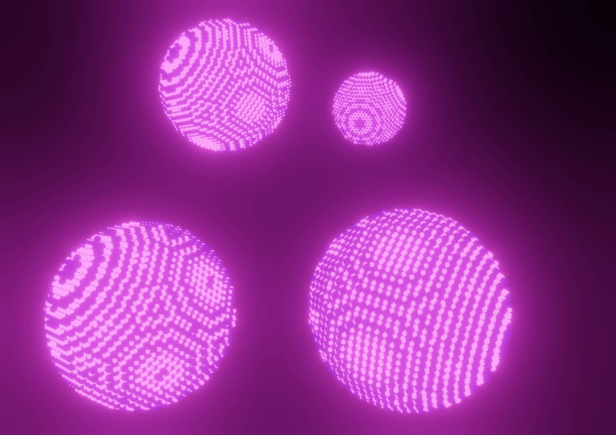 Four pink, glowing balls