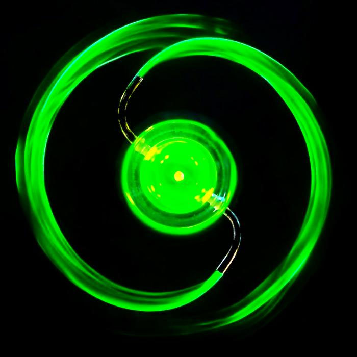 This photograph shows fluorescein dye being ejected from the sprinkler as it spins in forward mode