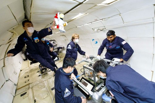 researchers test their nanoink and printer technologies during a NASA microgravity flight