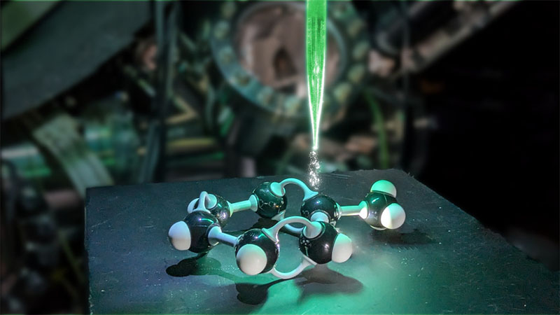An artist's representation of a scanning tunnelling microscope probing a toluene molecule