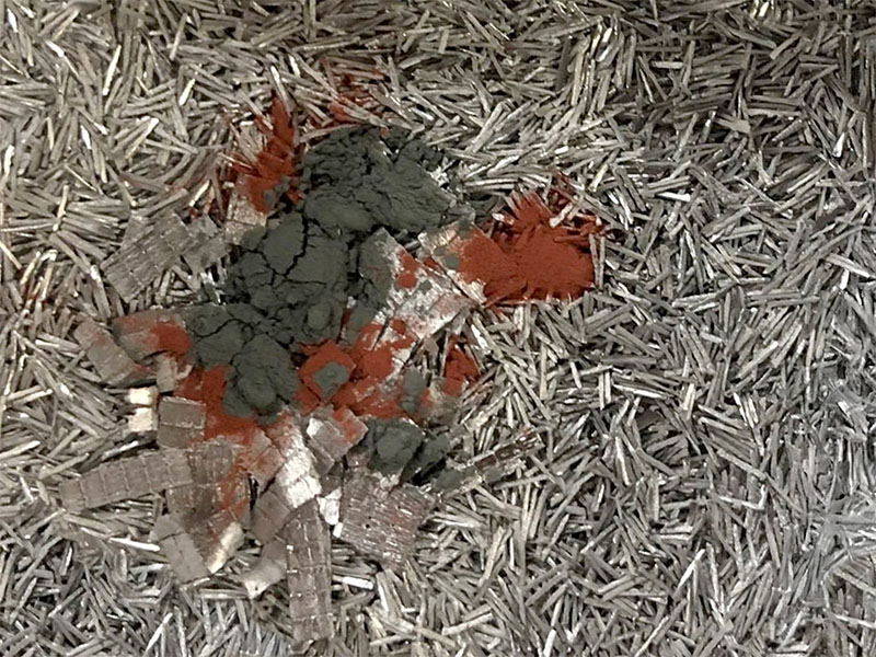 Scrap aluminum feedstock with metal additives