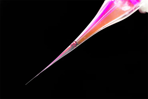 Pipette against black background