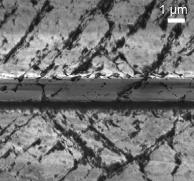 Scanning electron microscopy image of the epilayer (from the top), damaged substrate, graphitic layer and substrate
