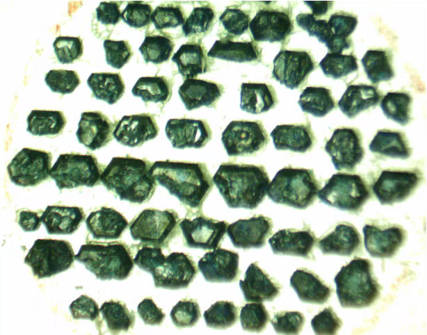 This photo shows an assembly of zinc barlowite crystals