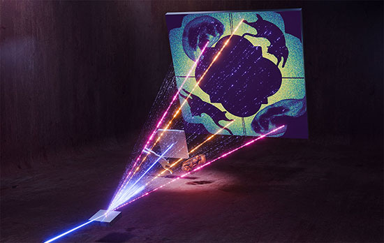 A conceptual schematic of 'ghost imaging' displays the samples being imaged, which include a cat-shaped tungsten test pattern and an E. cardamomum seed