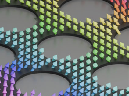 Spin waves on a thin film with holes arranged in a hexagonal pattern