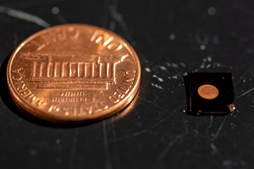 PlasmoSniff chip next to a penny